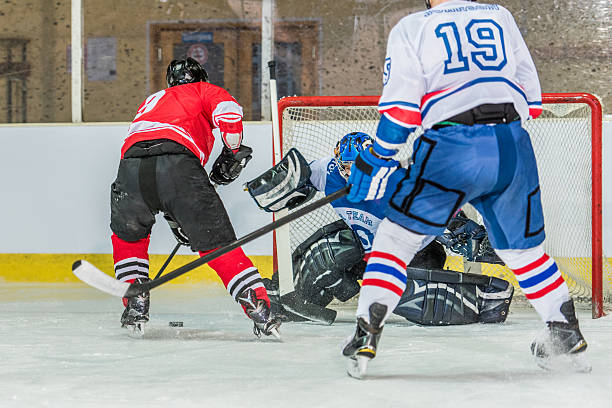 istock Men playing ice hockey 519682994