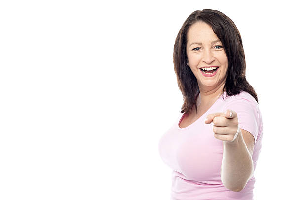 istock Happy woman pointing at the camera 519684705
