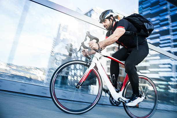 istock Commuter cycling fast at work in the morning 519684814