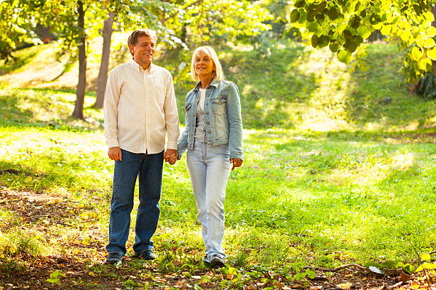 istock Mature couple walking in the  park 519685171