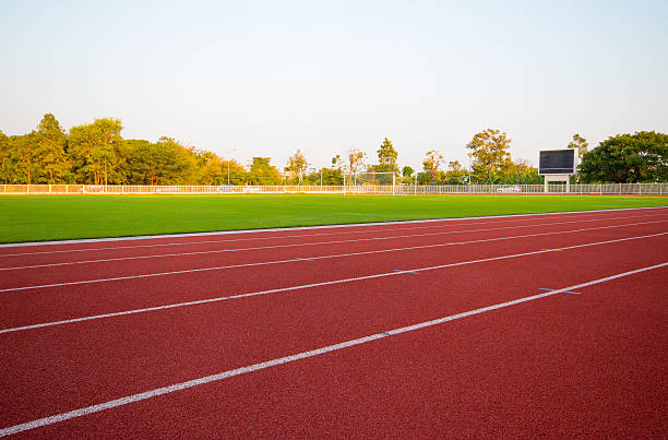 istock track running, Red treadmill in sport field. soft focus 519685346