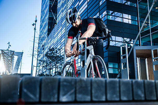 istock Commuter parking his bicycle outside the office entrance 519685456