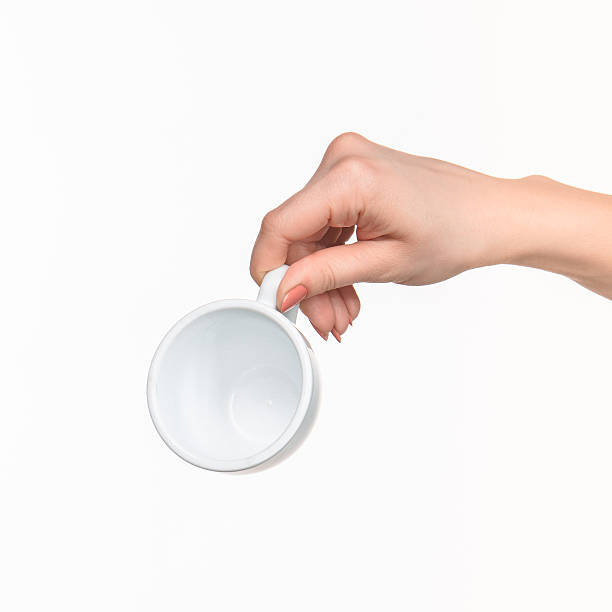 istock Woman hand with cup on white background 519685716