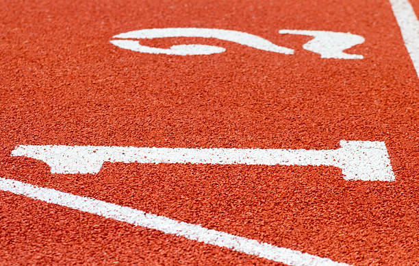istock Numbers on running track, Athletics Track Lane, selective focus 519685846