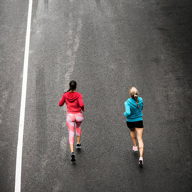 istock Young woman running on the streets 519686734