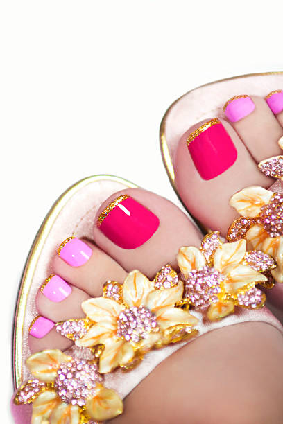 istock Pedicure with Golden flowers. 519686851