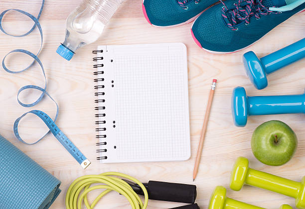 istock Fitness equipment and blank notebook 519689760