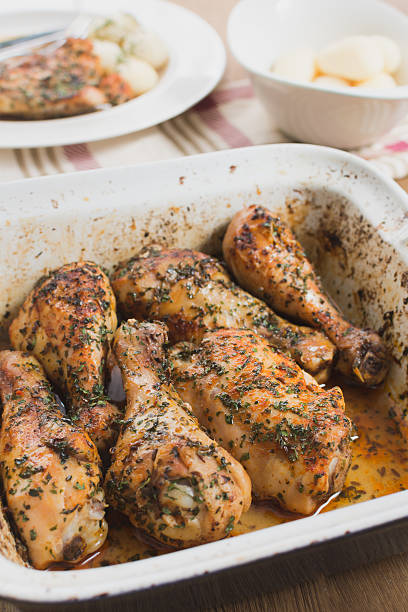 istock baked chicken with herbs and potatoes 519690114