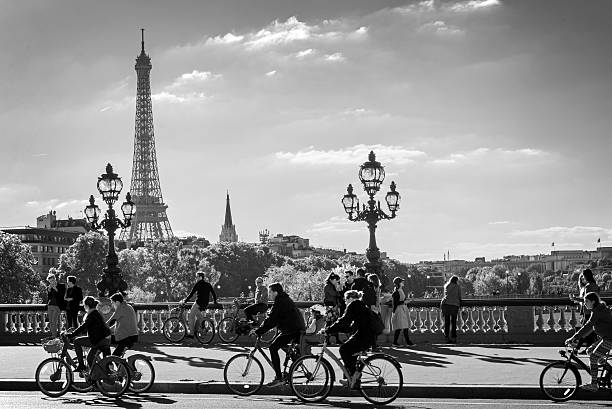 Paris, France - September 27, 2015: People on bicycles and pedestrians enjoying a car free day on Alexandre III bridge