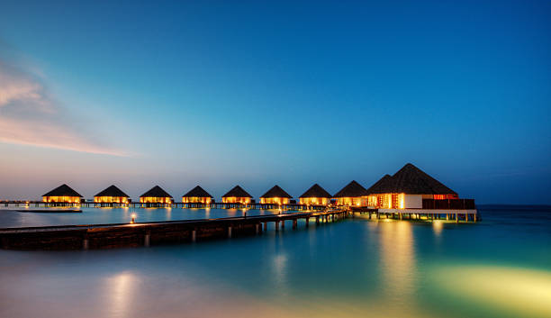 Water villas in hotel resort, Maldives stock photo
