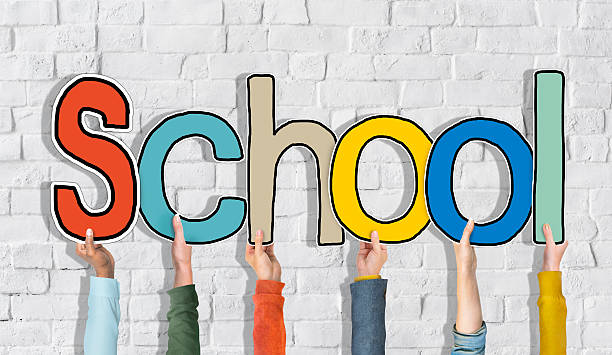 istock Diverse People's Hands Holding Word School 519701873