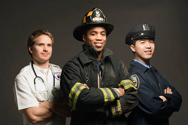 police officer, paramedic and fireman, on black background, port - fire department heroes portrait occupation 뉴스 사진 이미지