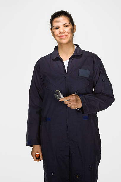 istock Female mechanic holding wrench, on white background, portrait 519703003