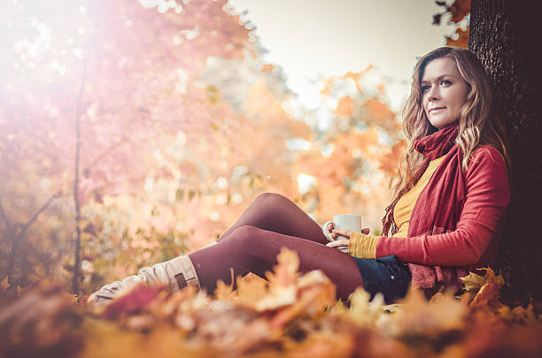 Young woman in autumn park, stock photo