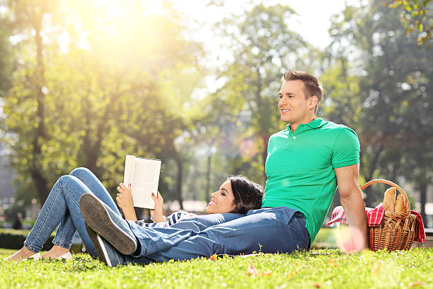 istock Boyfriend and girlfriend relaxing in park 519704739