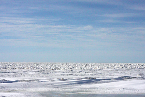 View of the frozen sea on a sunny day.