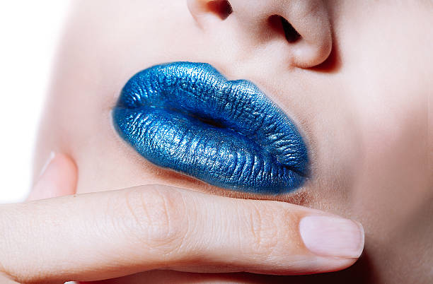 istock Woman lips with glossy blue lipstick 519705336