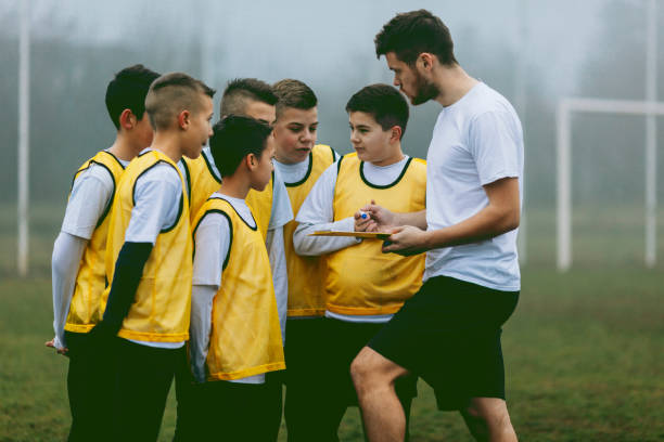 istock Kids Talking To Their Soccer Coach. 519705476