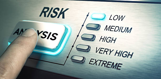 Risks analyze, low risk man finger about to press an analysis push button. Focus on the blue led. Concept image for illustration of risk management or assessment. scrutiny stock pictures, royalty-free photos & images