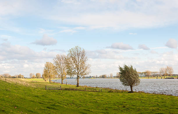 istock Dutch river on a cloudy day in in autumn 519706485