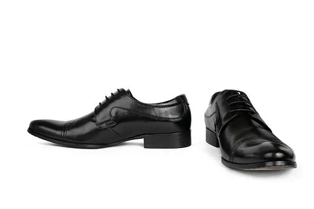 Front and side view of elegant man's shoe with shoelaces  on white background.
