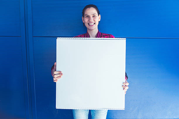 istock Beautiful girl with white banner 519709924