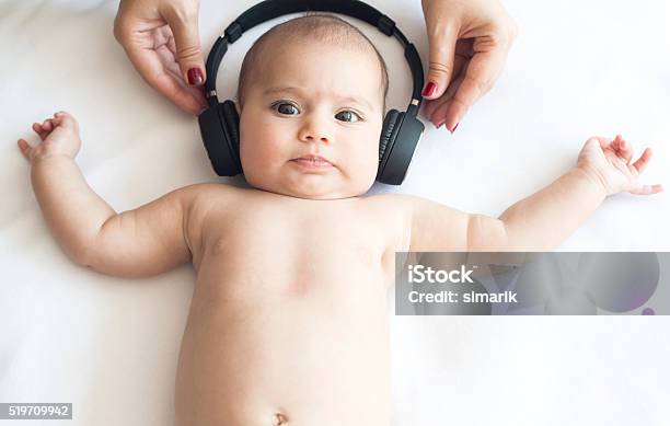 Beautiful Baby On White Towel With Headphone Stock Photo - Download Image Now - Baby - Human Age, Headphones, Music