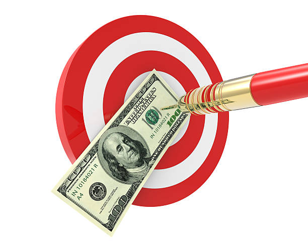 Bang on target 100 dollar bills Dart arrow isolated on white archery target group of objects target sport stock pictures, royalty-free photos & images