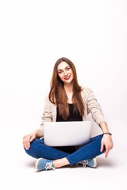 istock Happy woman sitting legs and using laptop 519711232