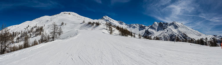 View over the snow-clad slopes of Sestriere in the Milky Way ski resort in Piedmont.