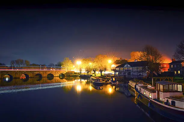 Thai boat house and the river Avon with Clopton bridge in the background, Stratford-upon-Avon, Warwickshire, England.