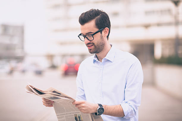 istock Businessman reading newspaper 519715172