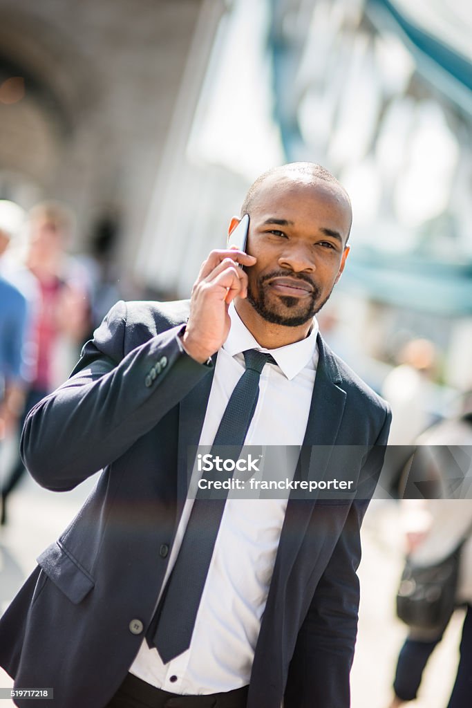 Businessman on the phone happiness on tower bridge Businessman on the phone in London  African Ethnicity Stock Photo