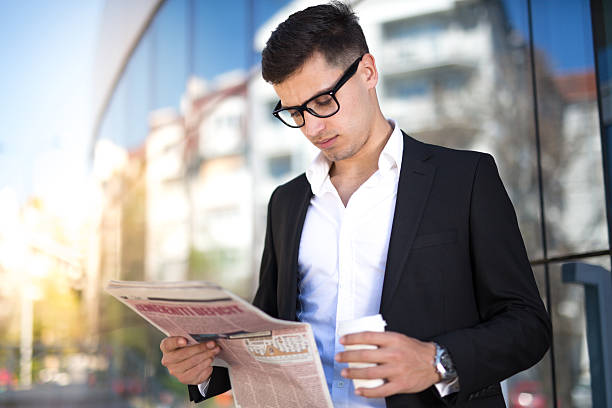 istock Business Man With Coffee and Newspaper 519718342