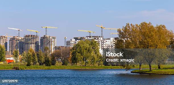 Building Cranes On Construction Stock Photo - Download Image Now - Architecture, Blue, Building - Activity