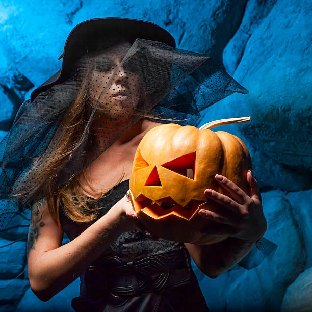 istock Halloween concept with young witch woman 519720985