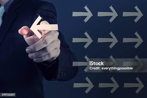 Businessman Hand Selecting Different Arrows Stock Photo - Download Image Now - Adult, Business, Businessman