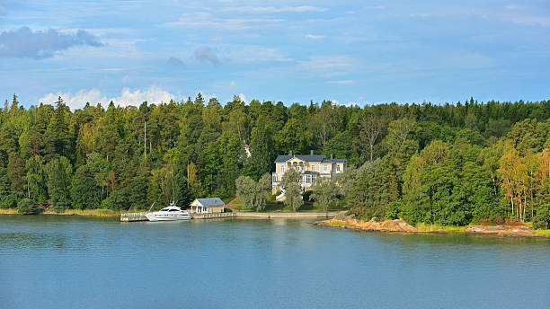 istock Luxury mansion with a pier on shore 519725237