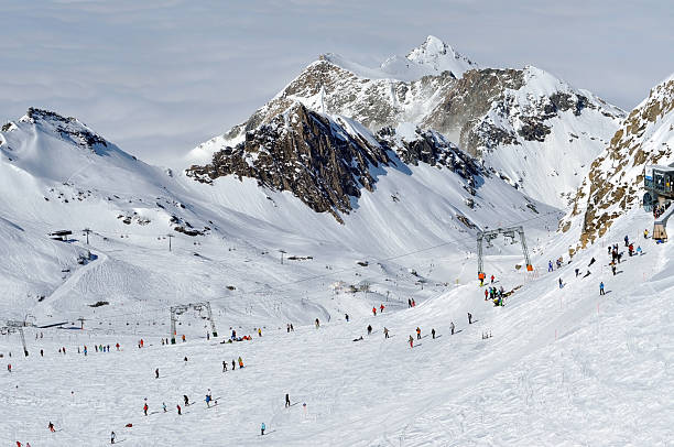 istock Skiers skiing on ski slope in a ski resort 519726009