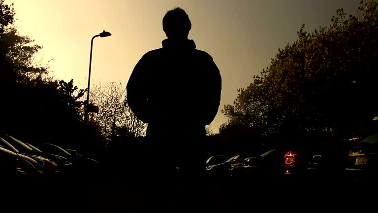 Silhouette of man approaching.