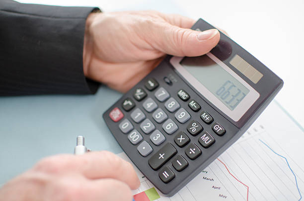 istock Businessman's hands with calculator 519727873