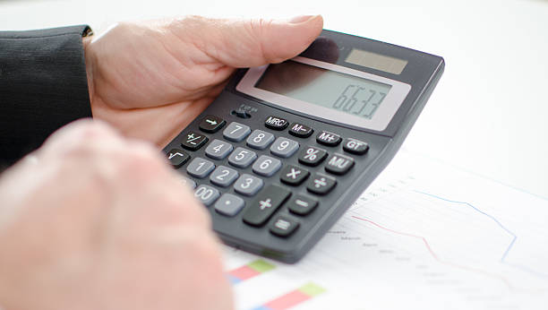 istock Businessman's hands with calculator 519727877