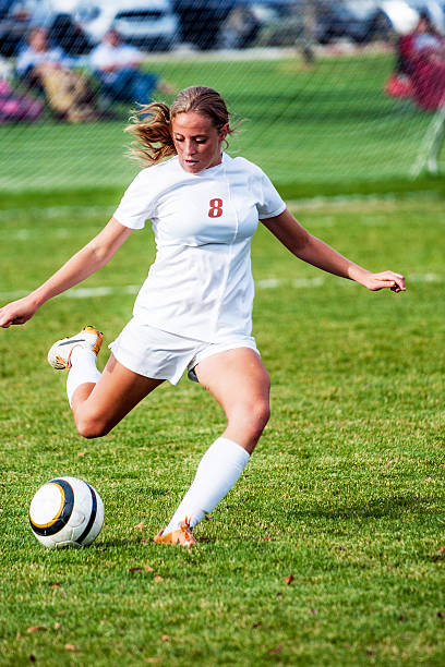 istock Female Soccer Player Kicks for Power with Copy Space 519728165