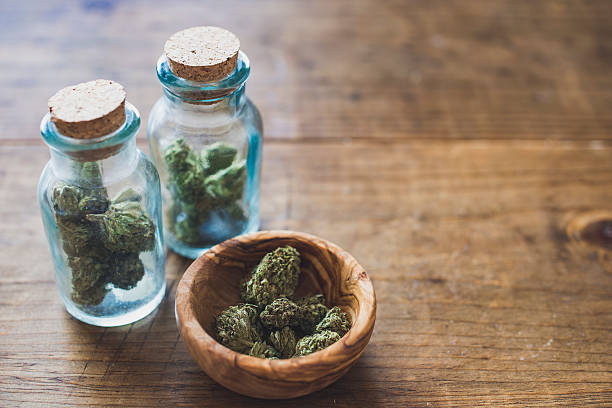 Cannabis in Glass Jars Marijuana, Medical, Cannabis Sativa, Cannabis Indica, legalization stock pictures, royalty-free photos & images
