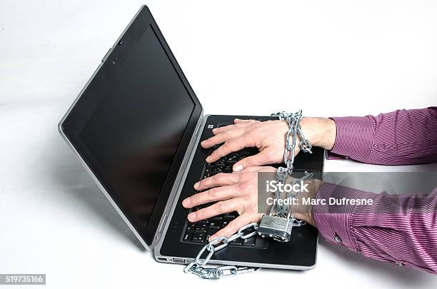 Laptop And Hands Locked With A Chain And Padlock Stock Photo - Download Image Now - Accessibility, Aggression, Attached