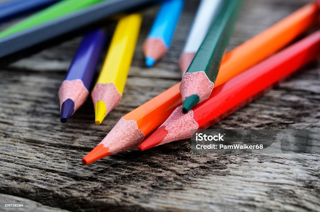 Pencil Crayons A close up image of colorful wooden pencil crayons on a wooden table.  Art Stock Photo