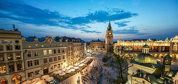 Krakow, Poland The market square in Krakow, Poland at sunset krakow stock pictures, royalty-free photos & images