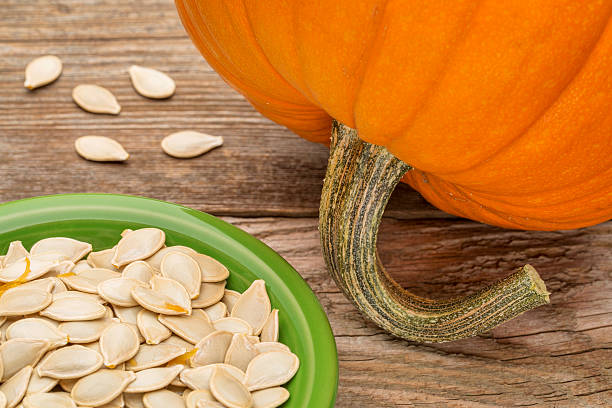 istock bowl of fresh pumpkin seeds 519746113