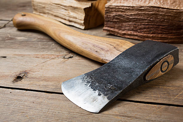 istock Wooden handle axe lying on wooden table 519746393