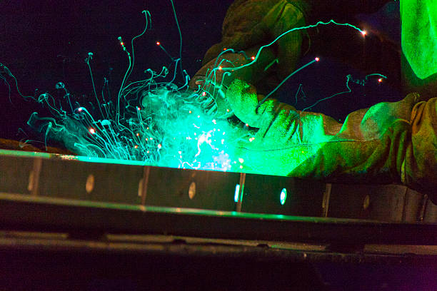 Oranger welder sparks stock photo